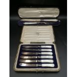 Box containing a silver and mother of pearl carving set; a box of silver and mother of pearl knives