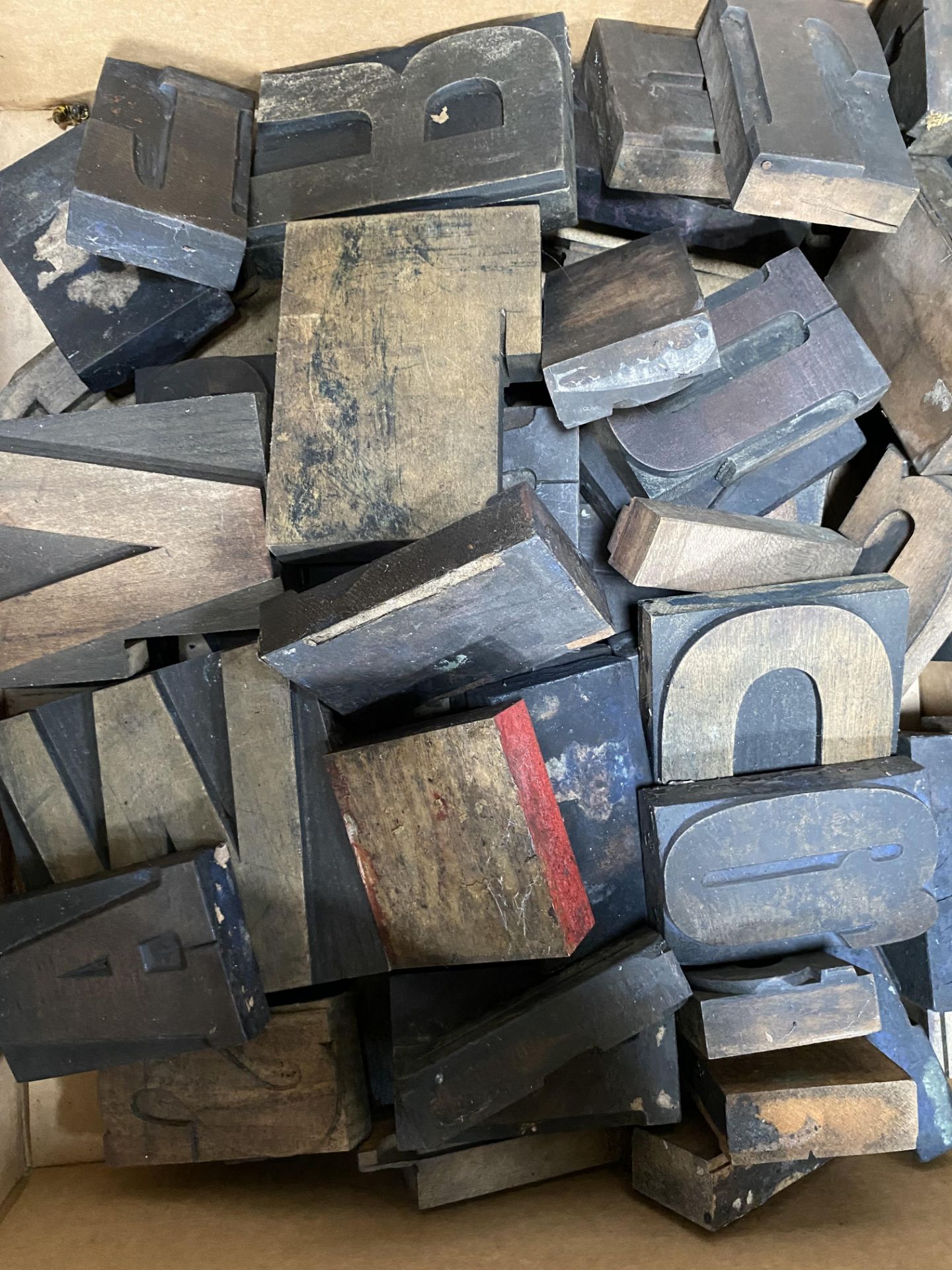 Quantity of wood printer's letter blocks.