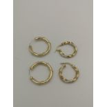 Pair of 9ct gold earrings; together with a pair of silver earrings