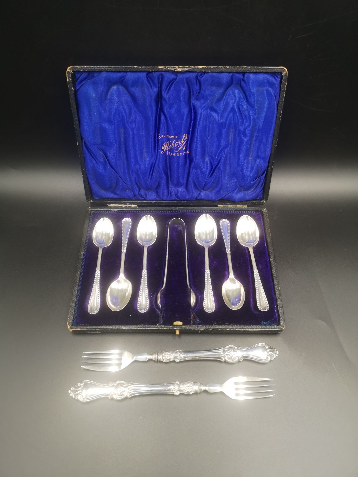 Boxed set of silver tea spoons together with two silver forks