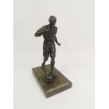 Bronzed figurine of a footballer