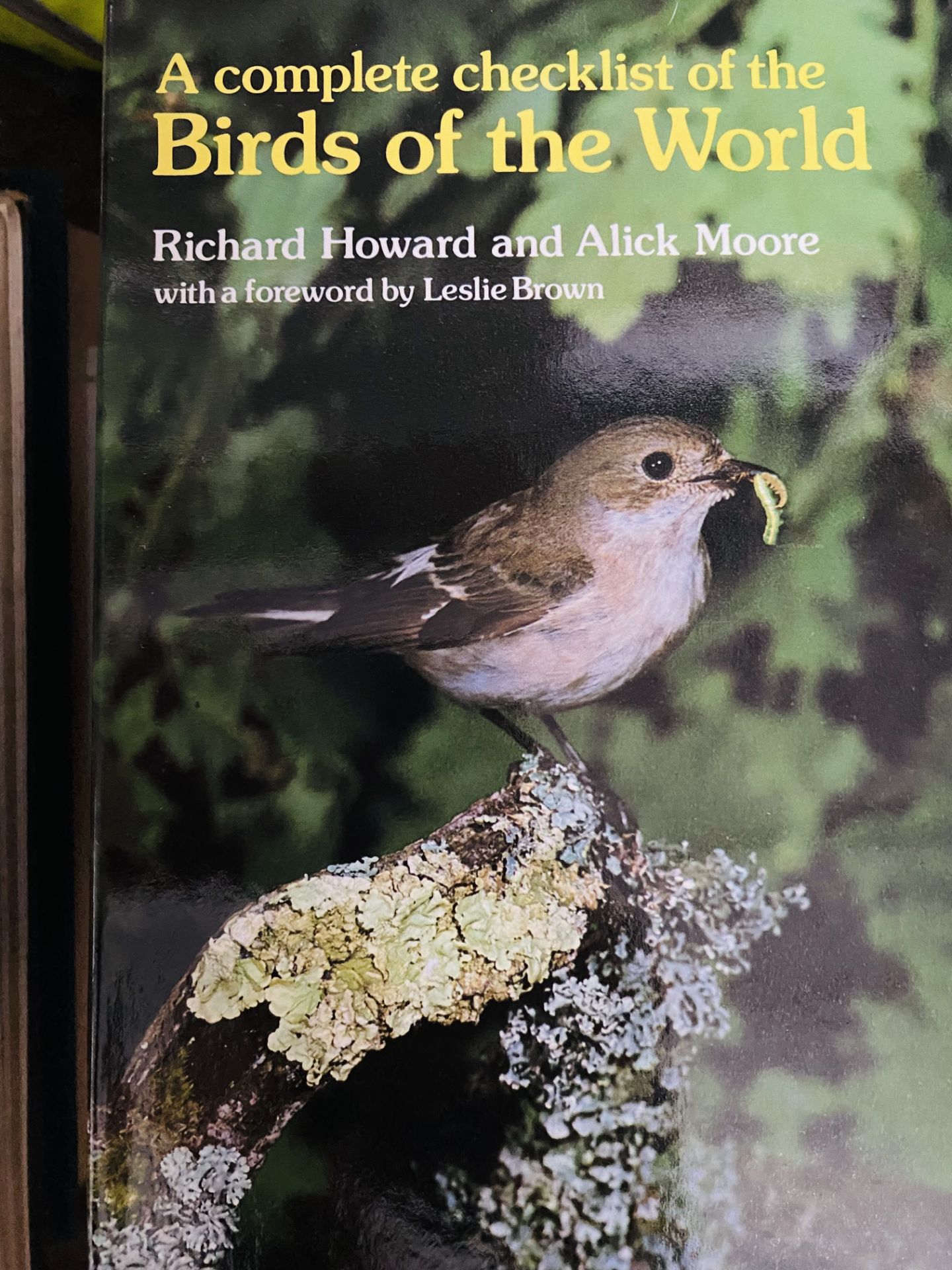 Twelve copies of A Complete Checklist of the Birds of the World by Richard Howard