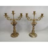 Pair of gilt metal candelabras on onyx bases