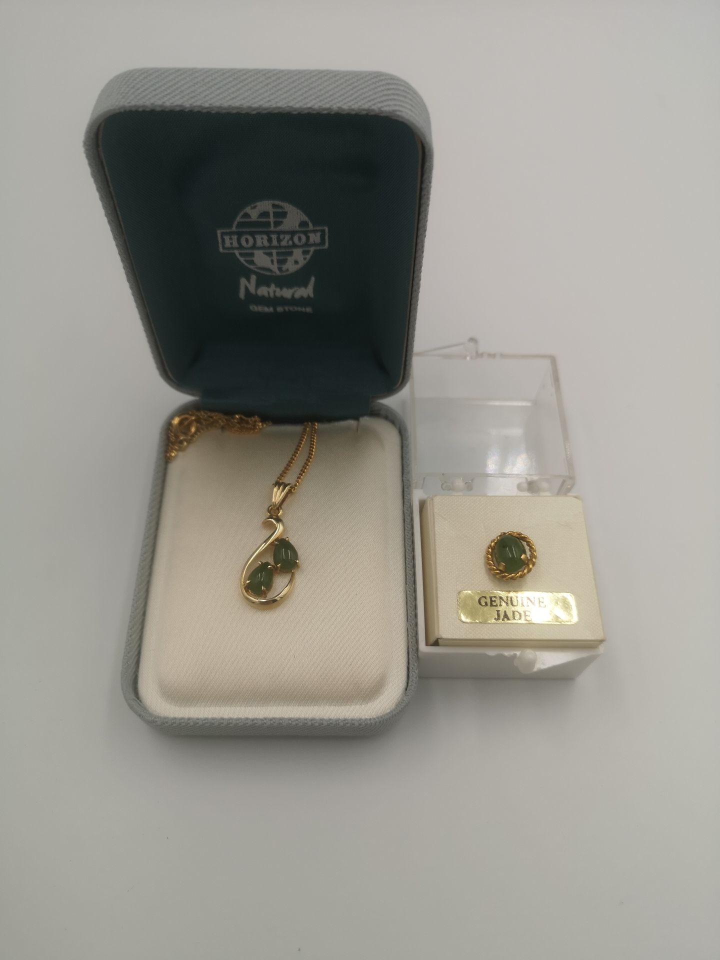 9ct gold and jade set pendant together with a jade fob