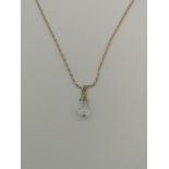 9ct gold chain with 9ct gold set glass pendant