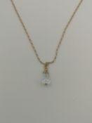 9ct gold chain with 9ct gold set glass pendant