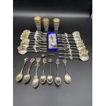 Eighteen white metal spoons, together with a quantity of silver plate items