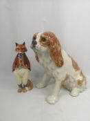 Winstanley pottery King Charles Spaniel; together with a Cinque Ports pottery fox.