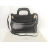 Salvatore Ferragamo black leather handbag with gold hardware and dust cover