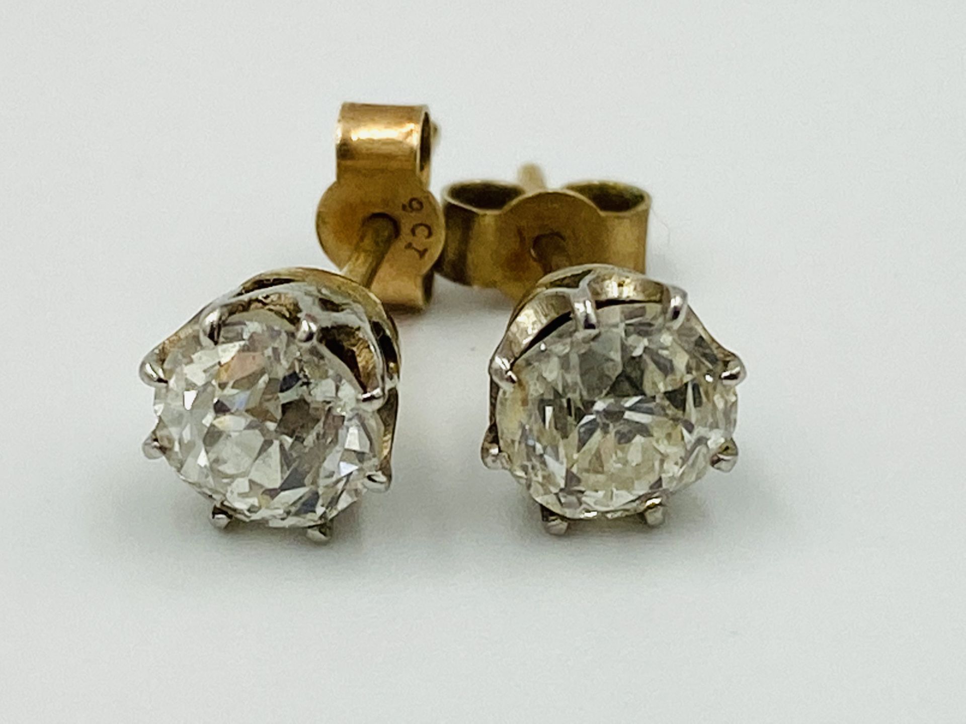 Pair of 9ct gold and diamond earrings