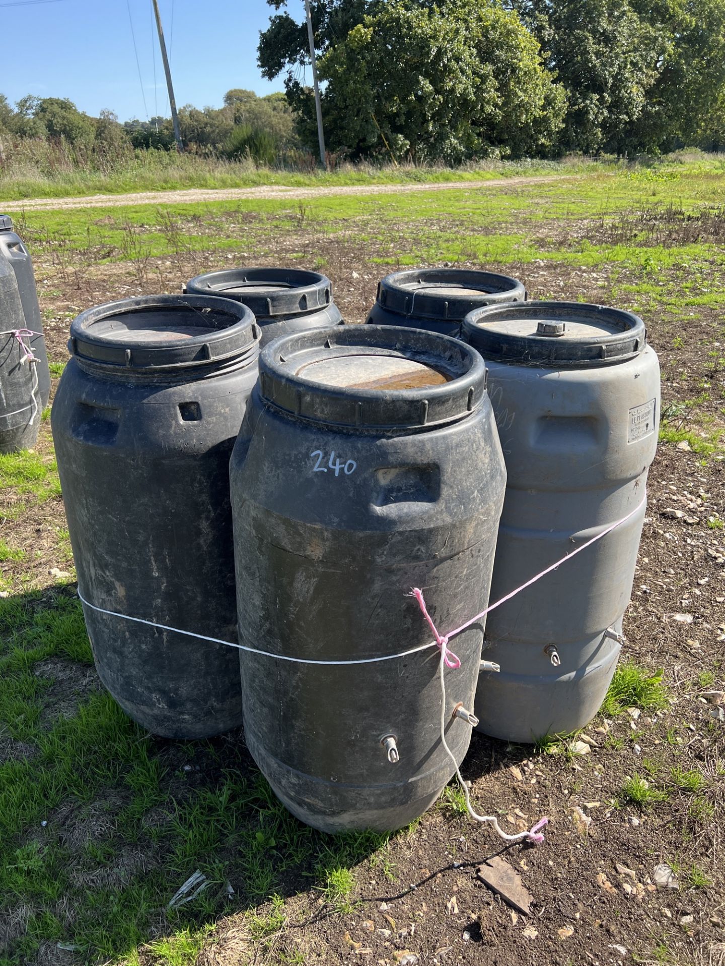 5 plastic 40 gallon drums with nipple drinkers