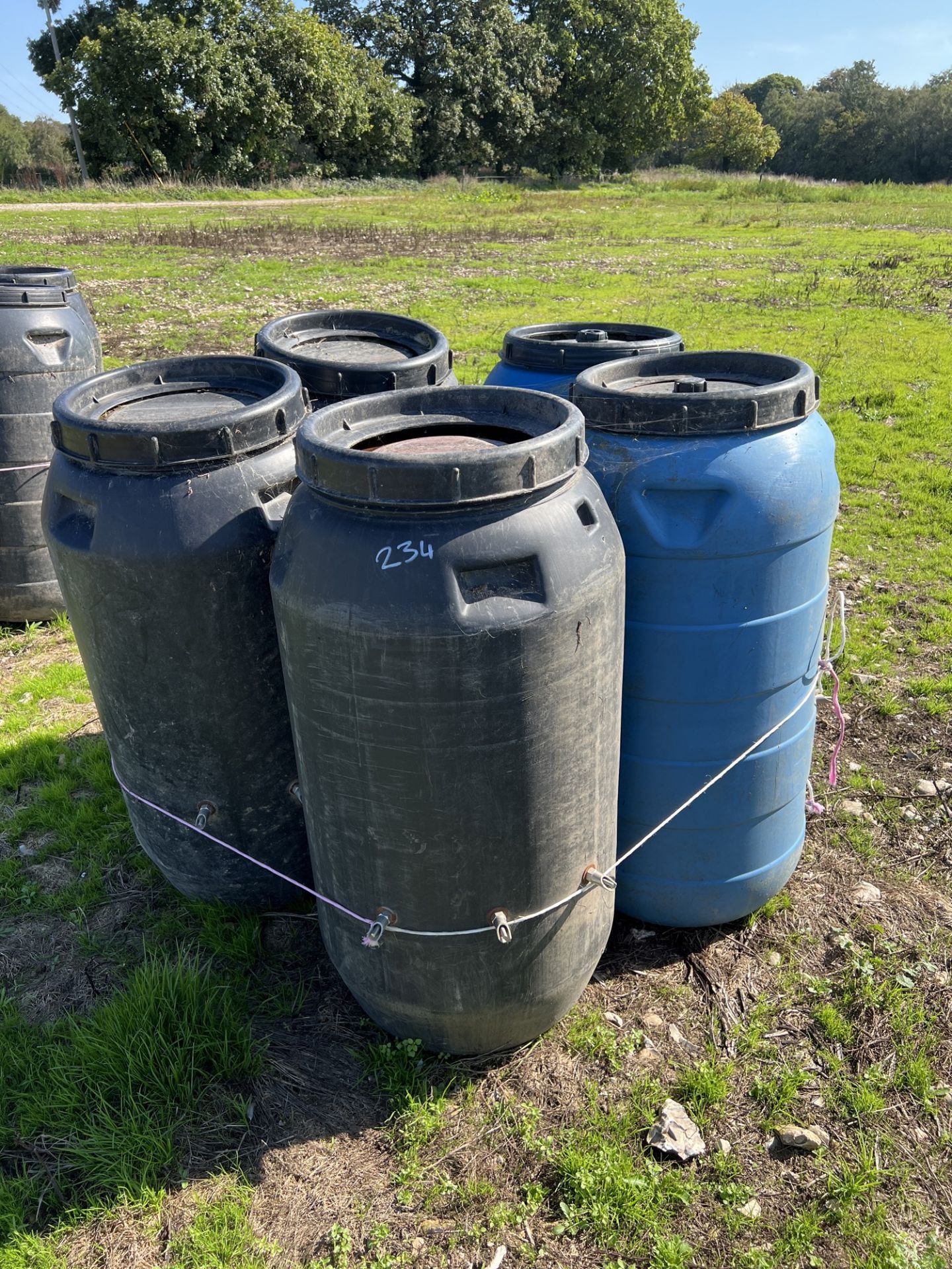 5 plastic 40 gallon drums with nipple drinkers