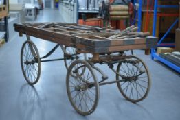 COFFIN BIER built by Drye of Marlow, 1901. In varnished wood on wire wheels, complete with leather