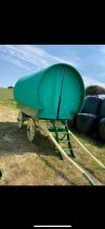 OPEN LOT WAGON painted green on yellow undercarriage with 12 and 14 spoke iron shod wheels. Newly