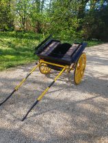 SQUARE-SIDED GOVERNESS CART to suit a 12 to 13hh. Painted black on a yellow undercarriage with 12