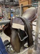 Brown leather 18.5" saddle by Barnsby with leathers and irons