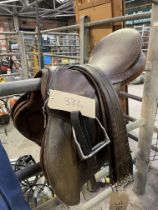 Brown leather 18.5" saddle by Barnsby with leathers and irons