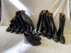 Box containing 6 pairs of long black riding boots and a pair of black jodhpur boots