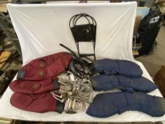 4 pairs of leathers and irons with 8 pairs of irons and a box of assorted tack.