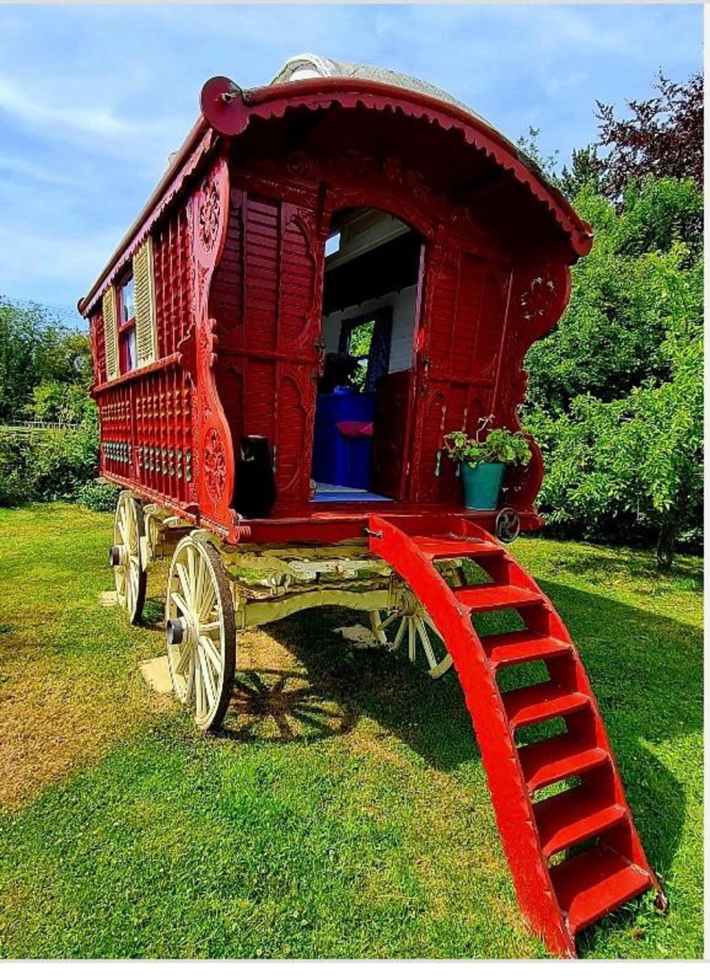 SHOWMAN'S WAGON built by William Wheeler of Guildford in 1914. Painted dark red on a cream