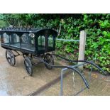 PONY HEARSE to suit 12hh single. Painted black with the wheels lined in white. The decorative roof