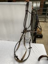 Full size rolled leather bridle with 6" kimberwick, together with another full size bridle with 5.5"