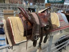 Brown leather Western saddle stamped Dinny, 16" from inside of cantle to back of horn