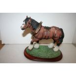 Model of a heavy horse with show harness by Leonardo collection