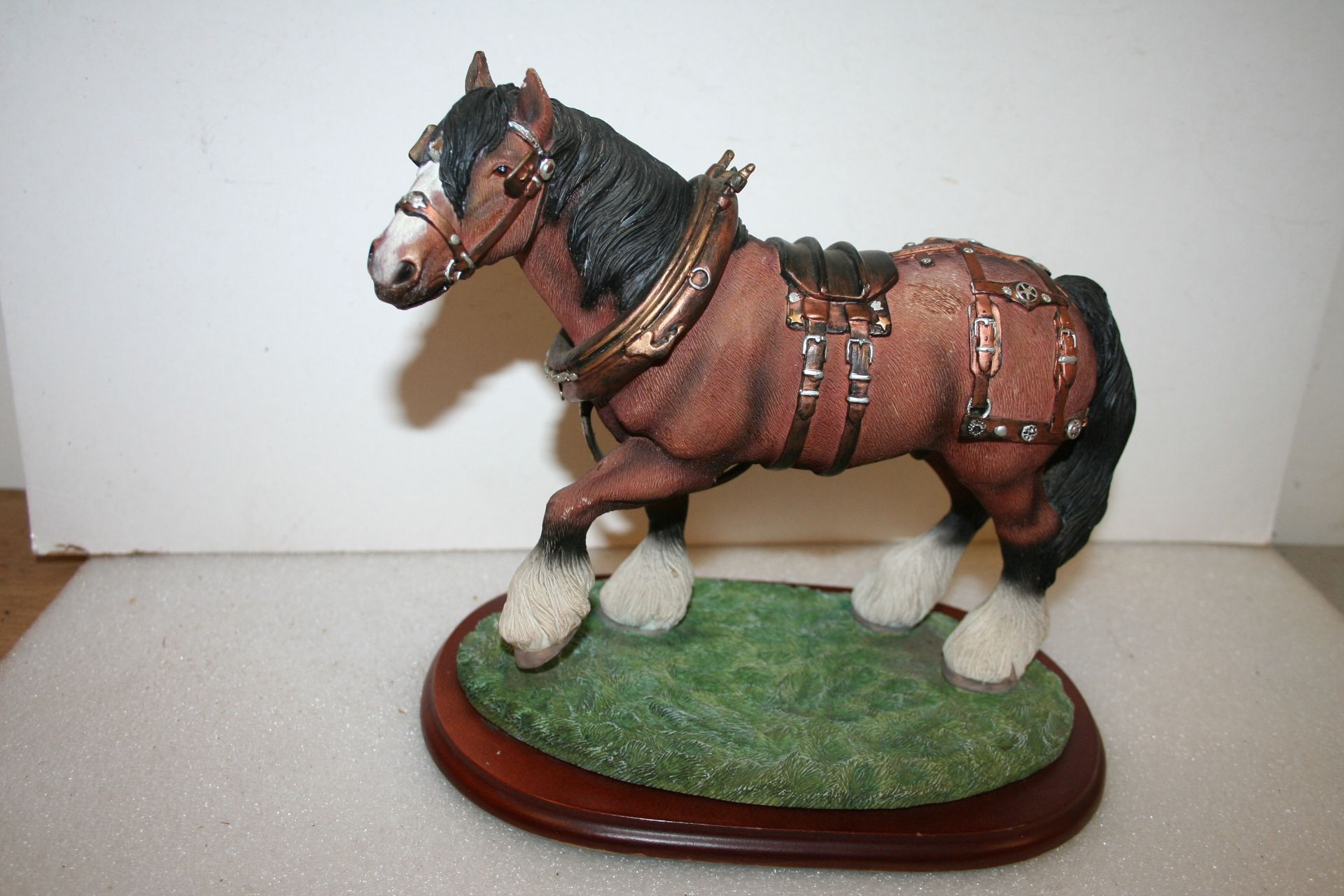 Model of a heavy horse with show harness by Leonardo collection