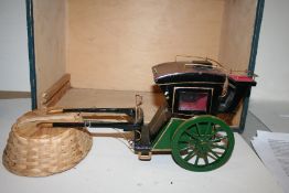 Model of a Hansom Cab, complete with carrying case. 14" long including shafts by 7 1/2" high.