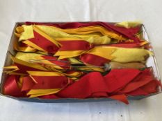 Box of yellow and red show ribbon, unused with a threader, together with 29 assorted horse brasses i