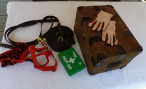 Wooden spares box with handles containing red cob size halter with rope, pair of driving reins