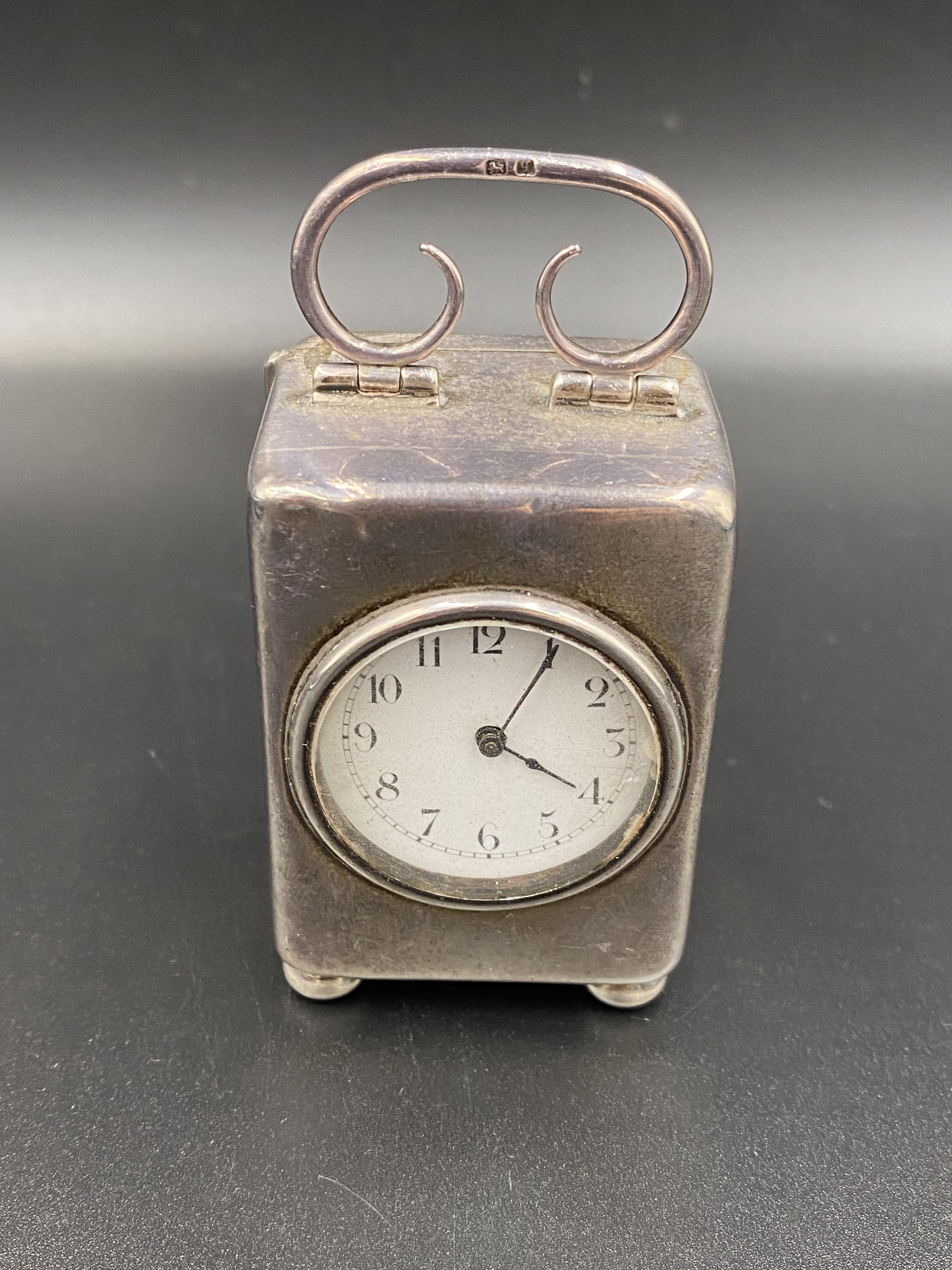 Silver cased bedside clock