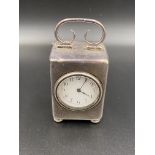 Silver cased bedside clock