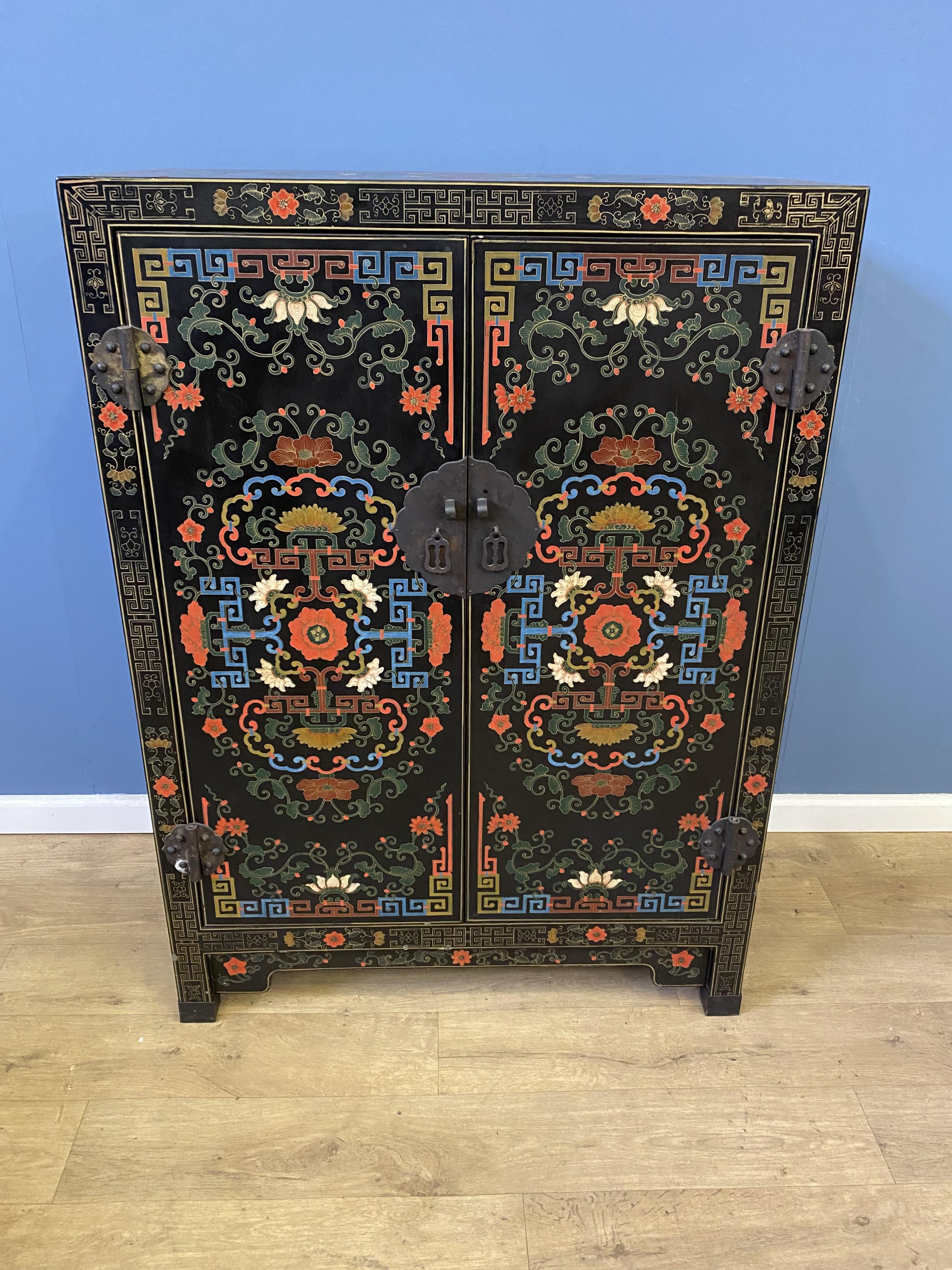 Oriental style two door cupboard