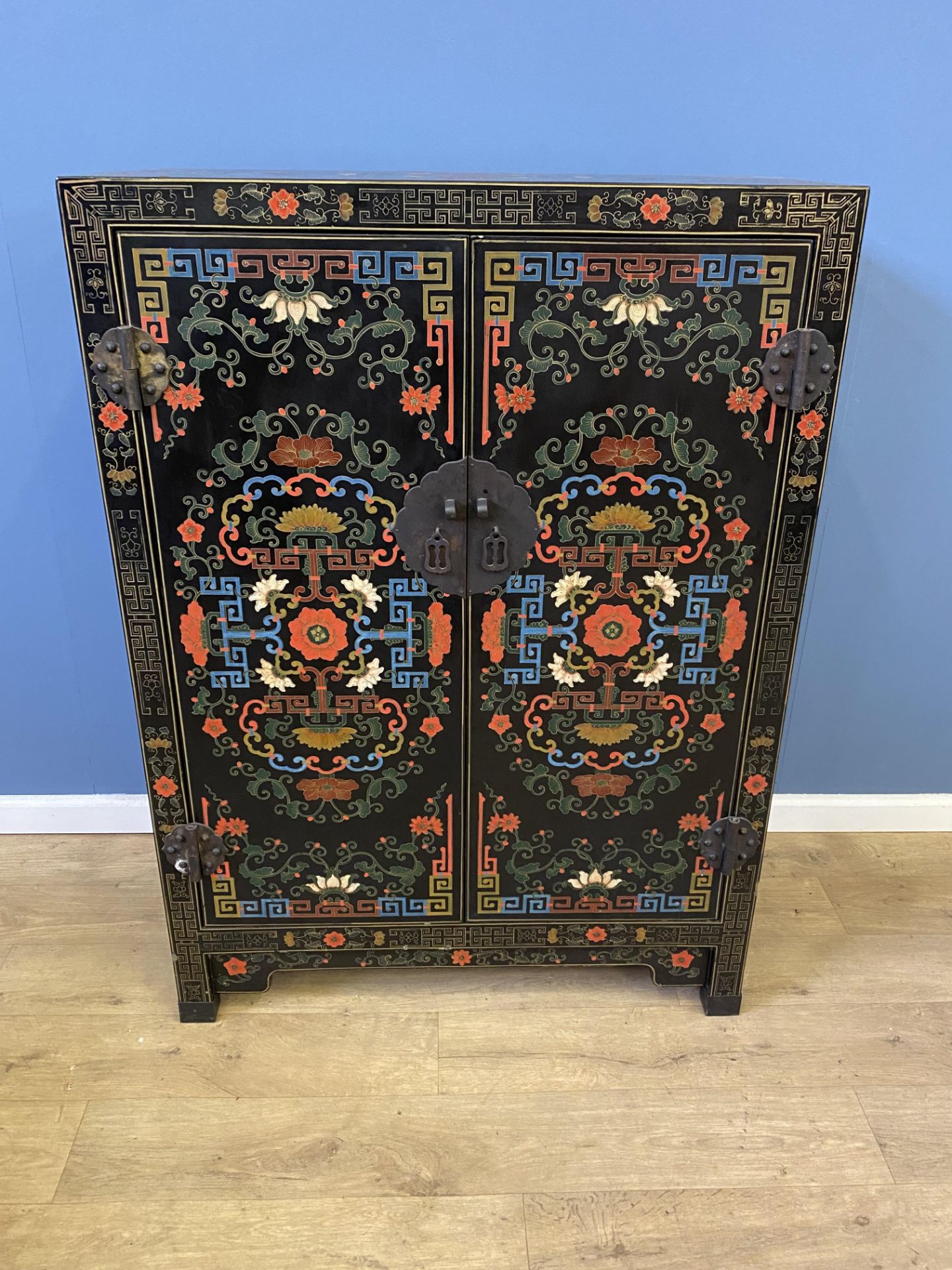 Oriental style two door cupboard