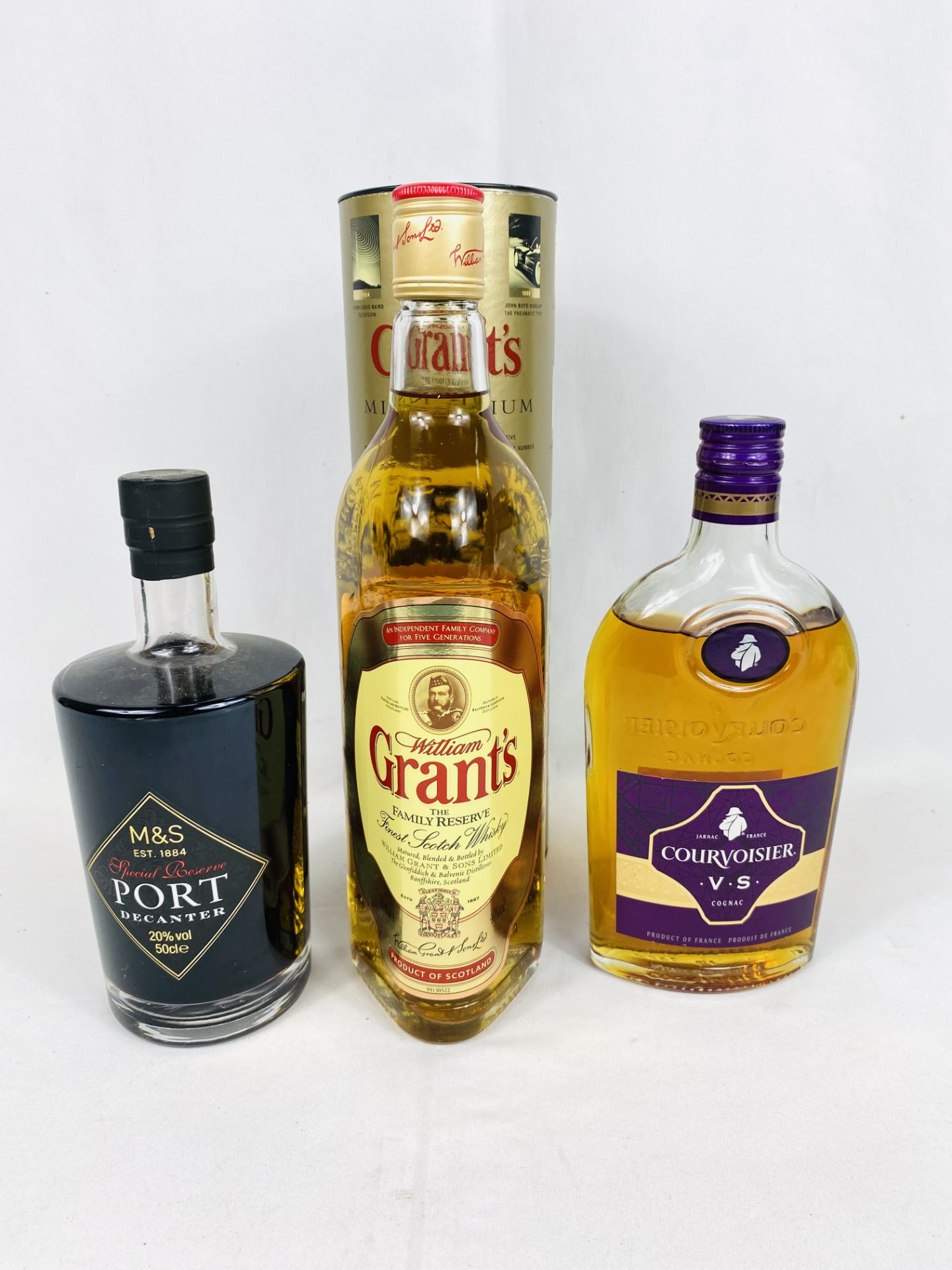 Bottle of Grant's Scotch whisky, bottle of Courvoisier brandy and a bottle of port