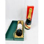 Bottle of Mumm Brut Champagne and a bottle of 1993 Château Laroche Joubert