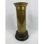 Brass vase mounted on a wood base