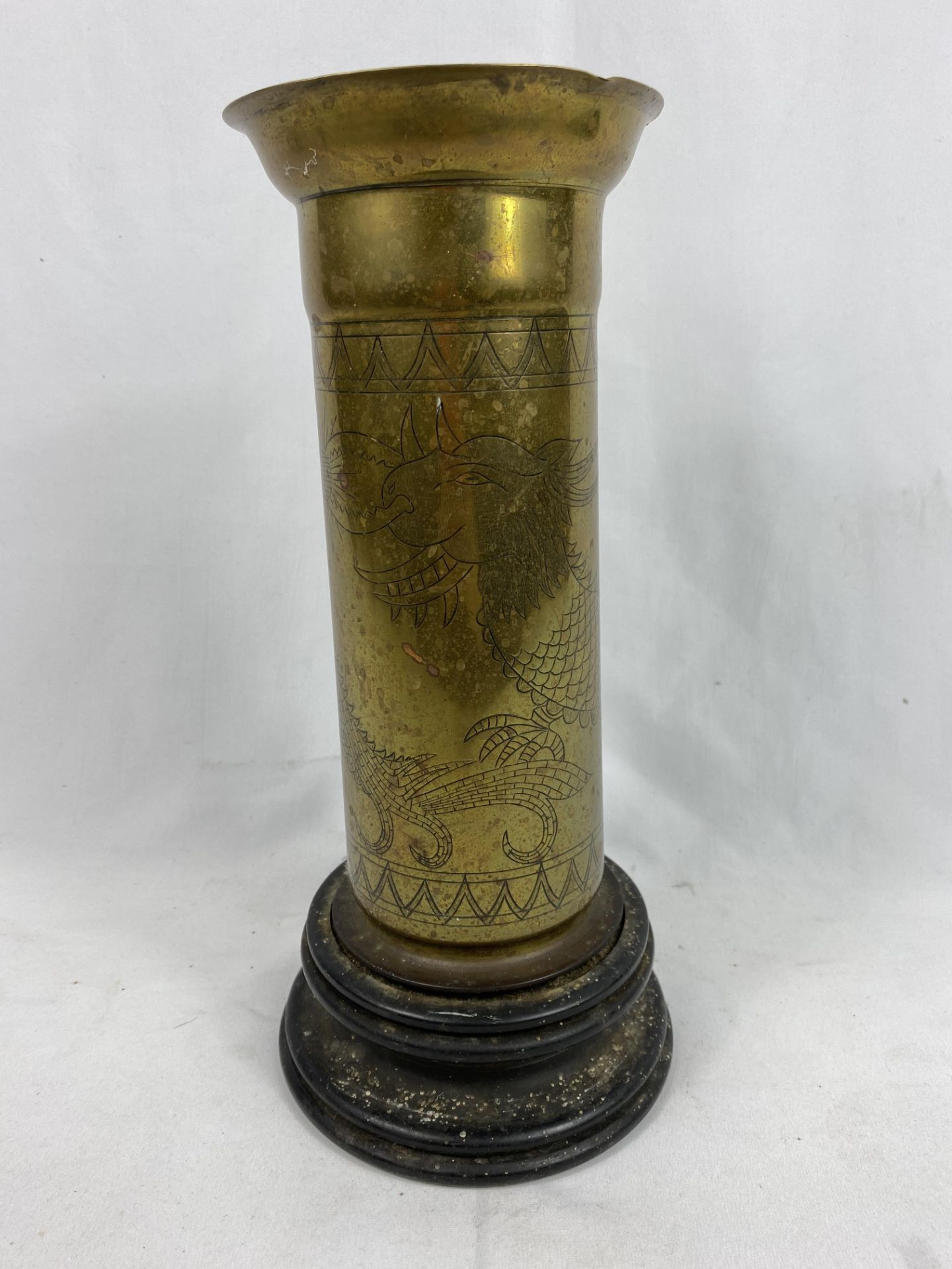 Brass vase mounted on a wood base
