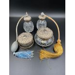 A quantity of silver topped dressing table jars and items