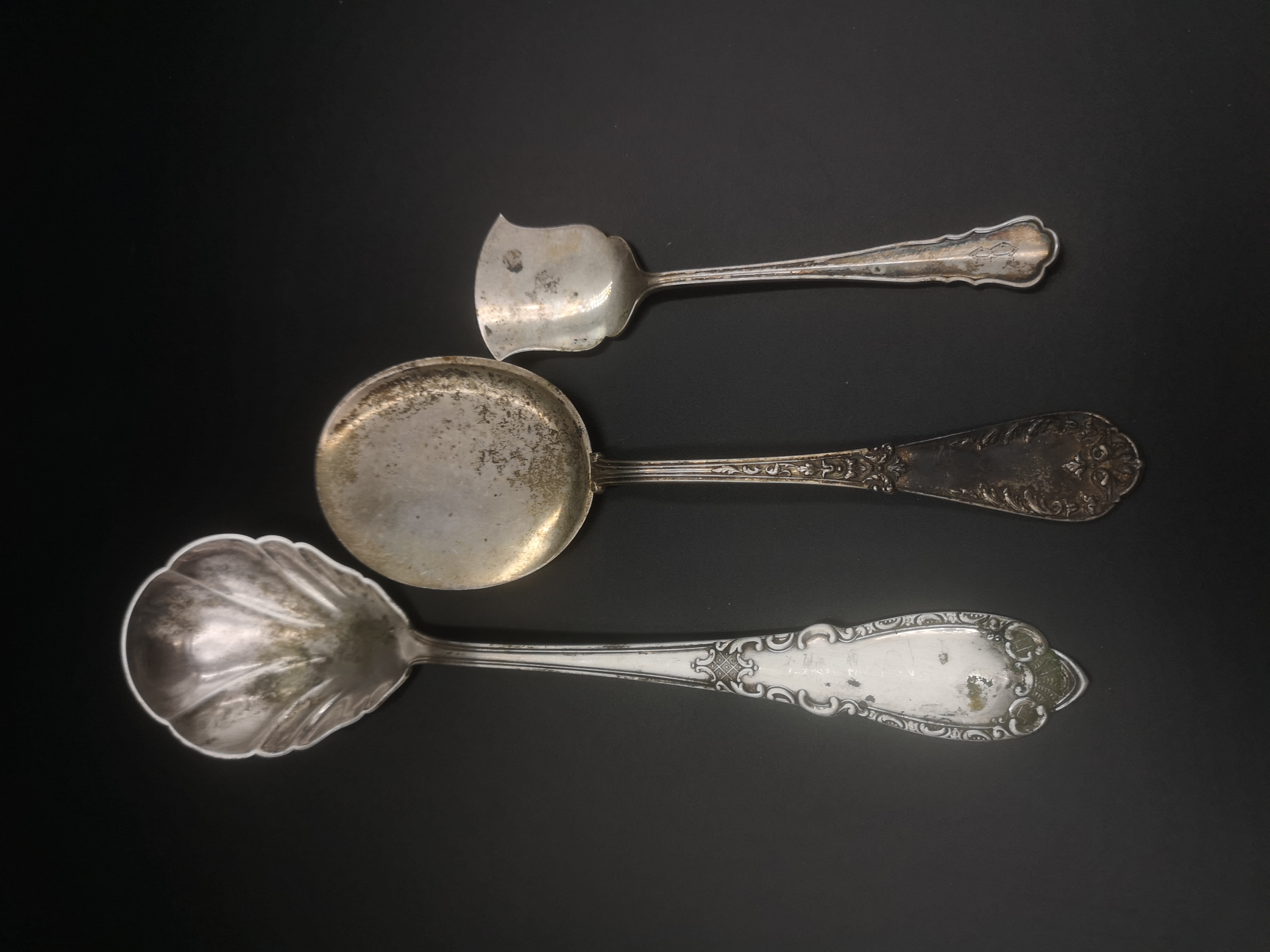 Two 800 standard silver serving spoons and one other