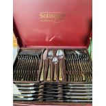 Two sets of Solingen twelve place cutlery.