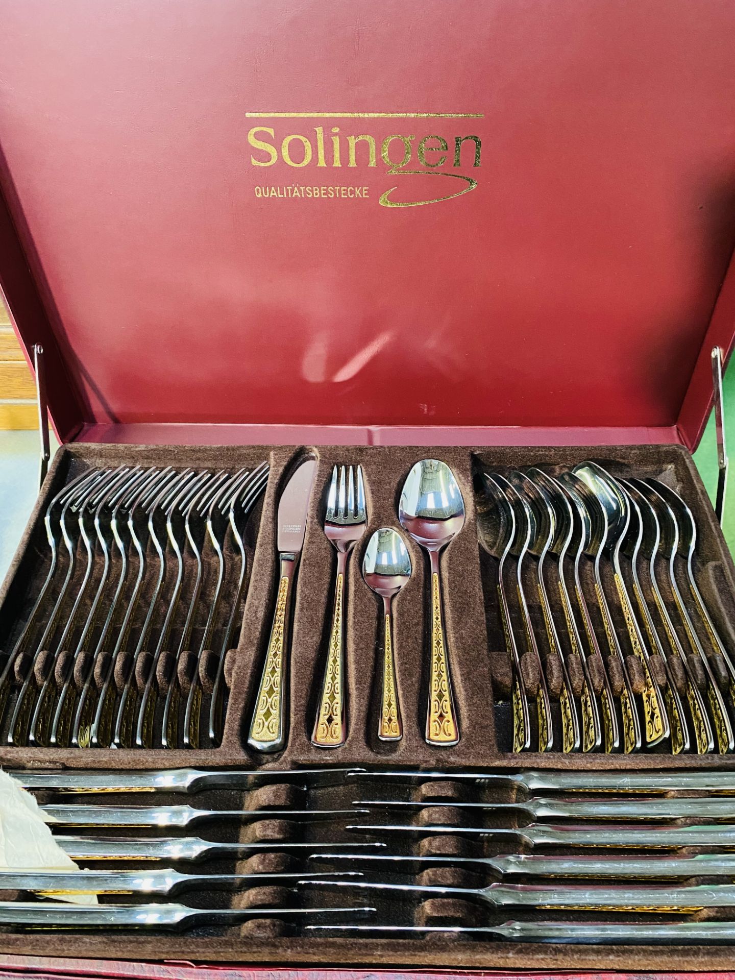 Two sets of Solingen twelve place cutlery.