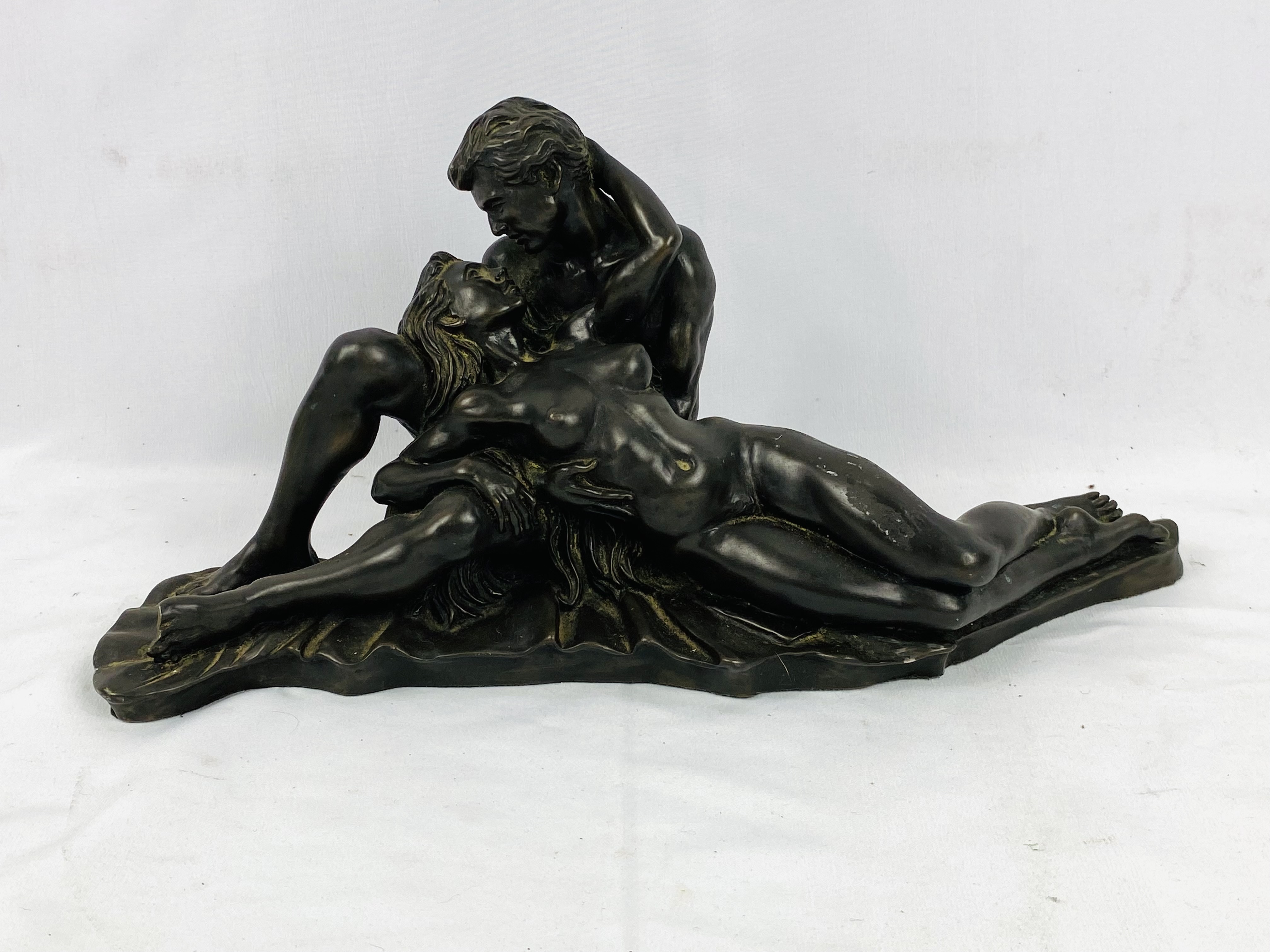 Resin bronzed sculpture of lovers embracing, signed R Cameron