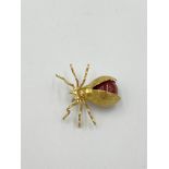 18ct gold spider brooch set with a carnelian cabochon