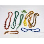 A malachite bead necklace together with a quantity of other bead necklaces