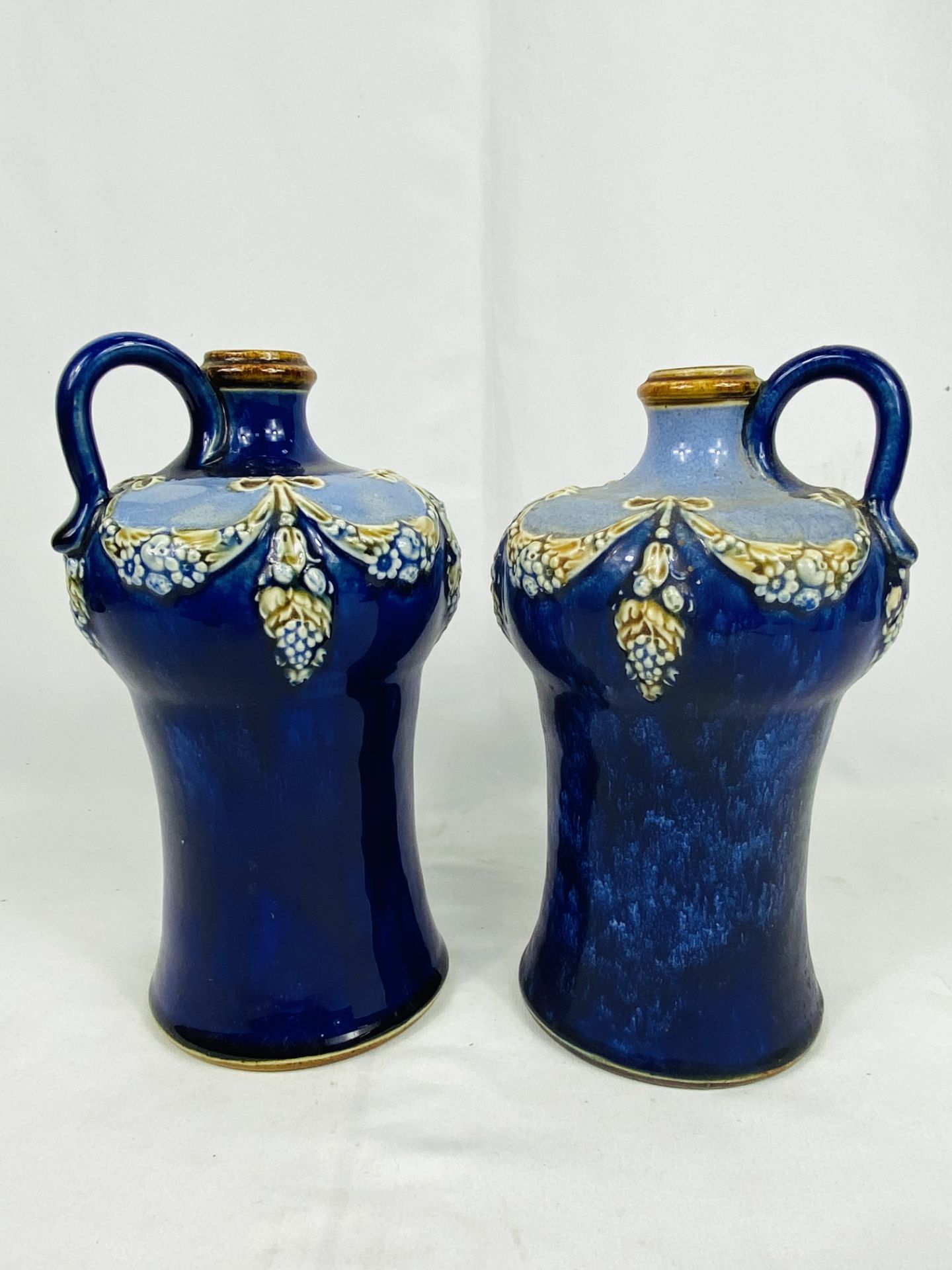 Two Royal Doulton blue glazed flagons