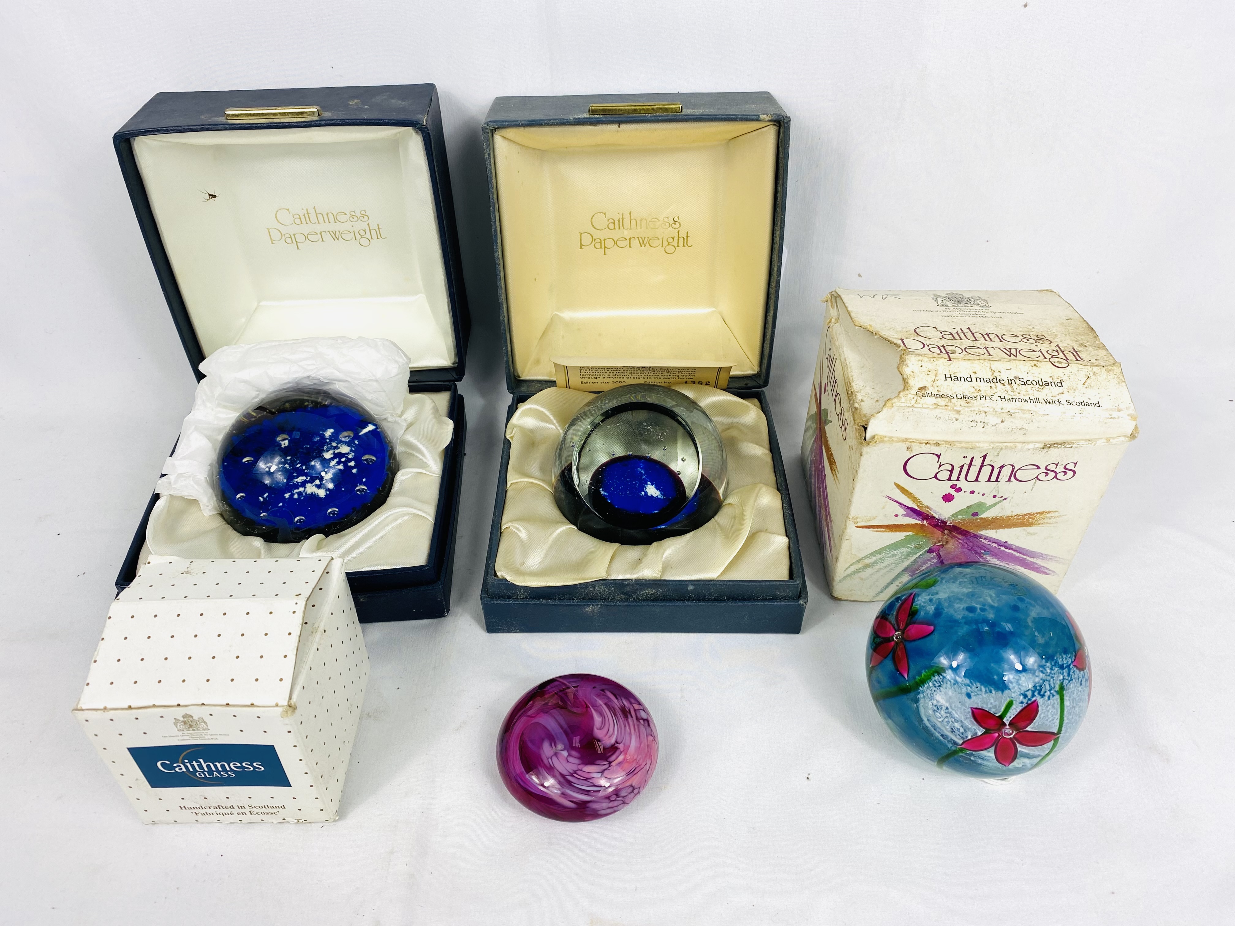 Four boxed Caithness paperweights