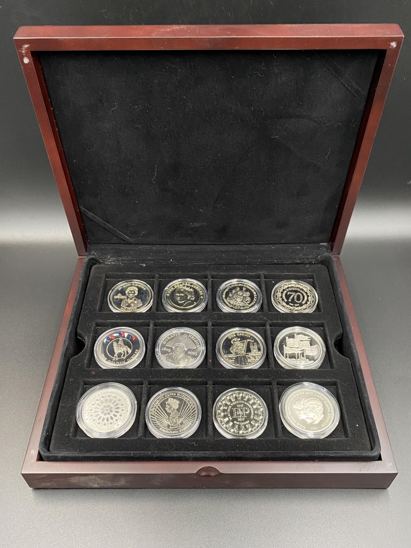 Twelve commemorative silver coins.